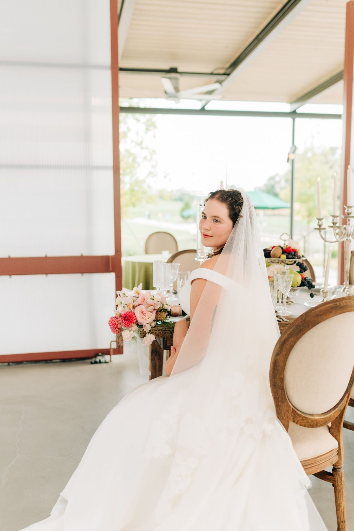 Moncus Park: bride seated at a reception table in the Doerle Pavilion