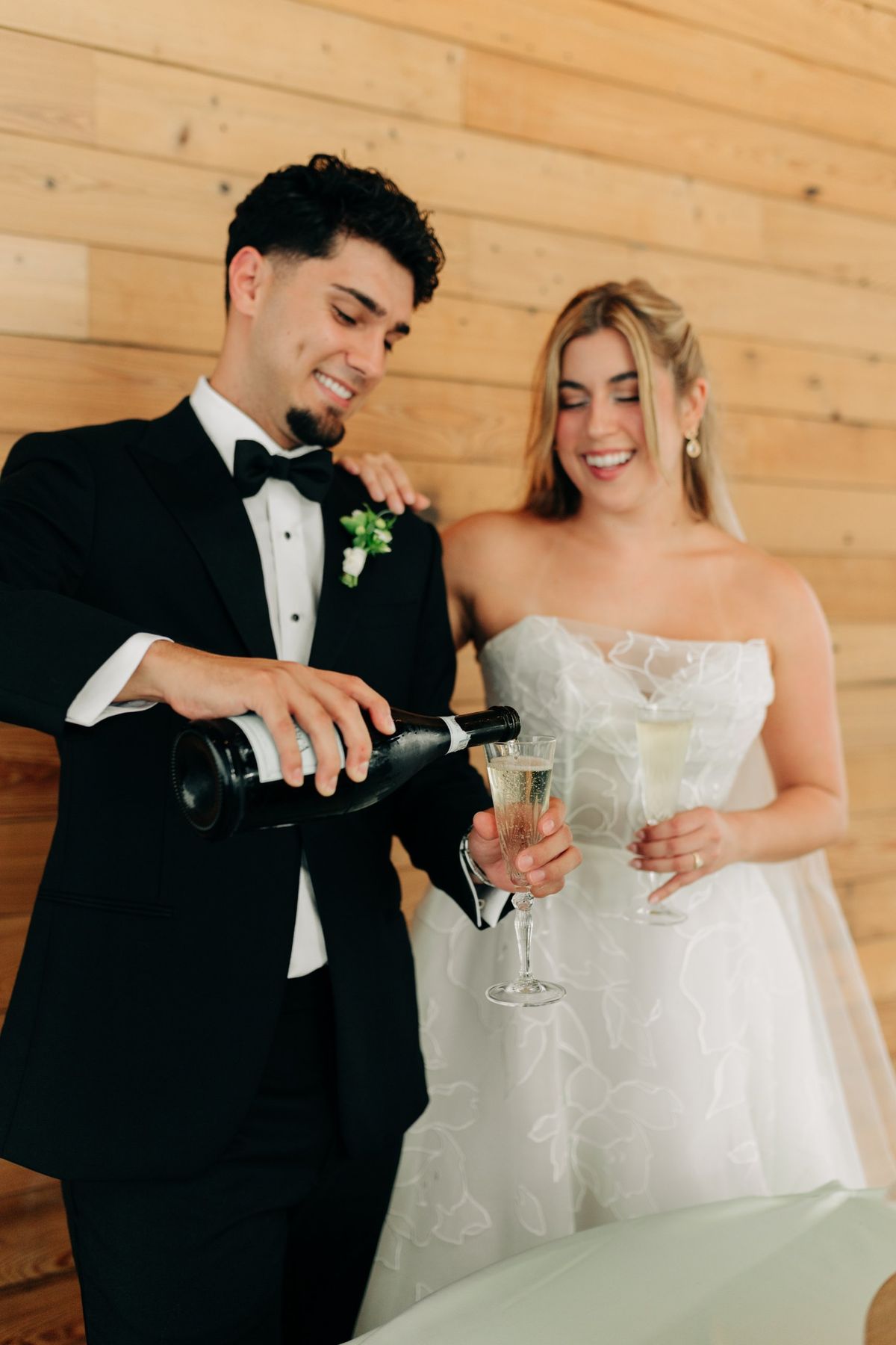 Moncus Park: groom pouring champagne for the couple's toast